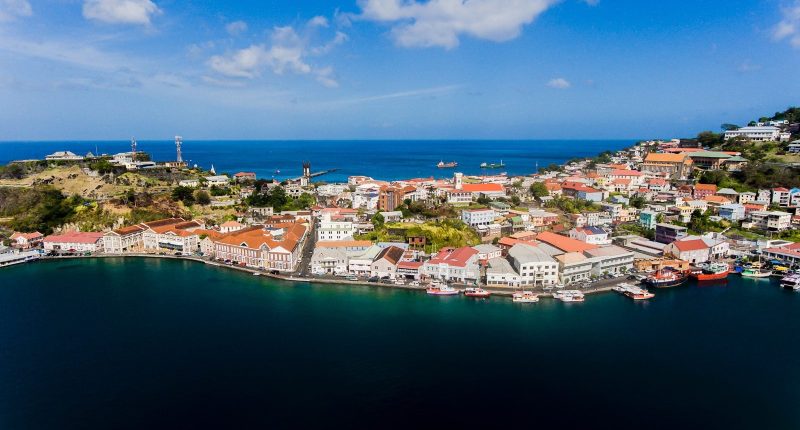 Grenada travel guide an aerial view of a city by the ocean